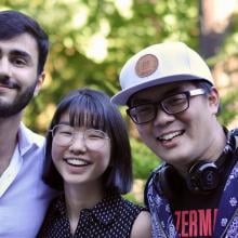 Three students smiling